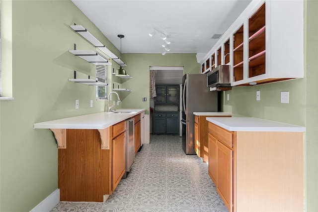 2915 Dean Ridge Rd, Orlando, FL 32825 - kitchen with open shelves, stainless steel appliances, light countertops, and a kitchen bar