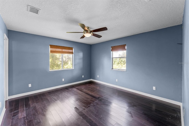 2915 Dean Ridge Rd, Orlando, FL 32825 - spare room featuring a ceiling fan, dark wood-style floors, and a textured ceiling