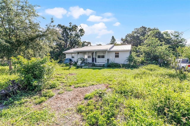 2915 Dean Ridge Rd, Orlando, FL 32825 - view of front of property featuring a porch and a metal roof