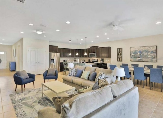 1606 Lima Ave, Kissimmee, FL 34747 - living room with light tile patterned flooring, recessed lighting, and ceiling fan