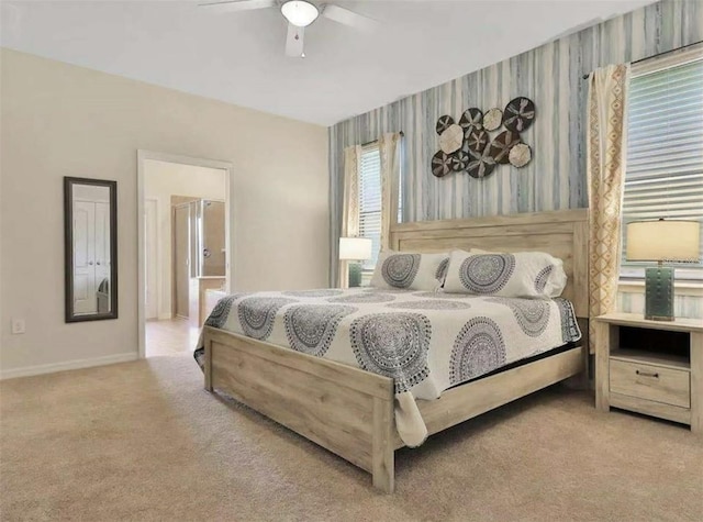 1606 Lima Ave, Kissimmee, FL 34747 - bedroom with carpet floors, wallpapered walls, and a ceiling fan