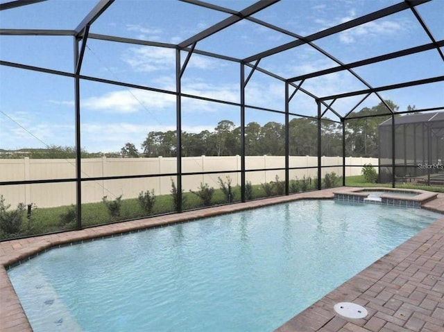 1606 Lima Ave, Kissimmee, FL 34747 - view of pool featuring a pool with connected hot tub and glass enclosure