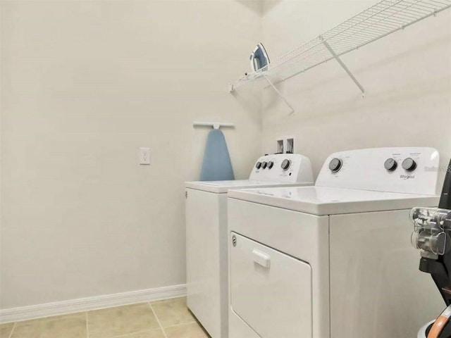 1606 Lima Ave, Kissimmee, FL 34747 - laundry area with independent washer and dryer and light tile patterned floors