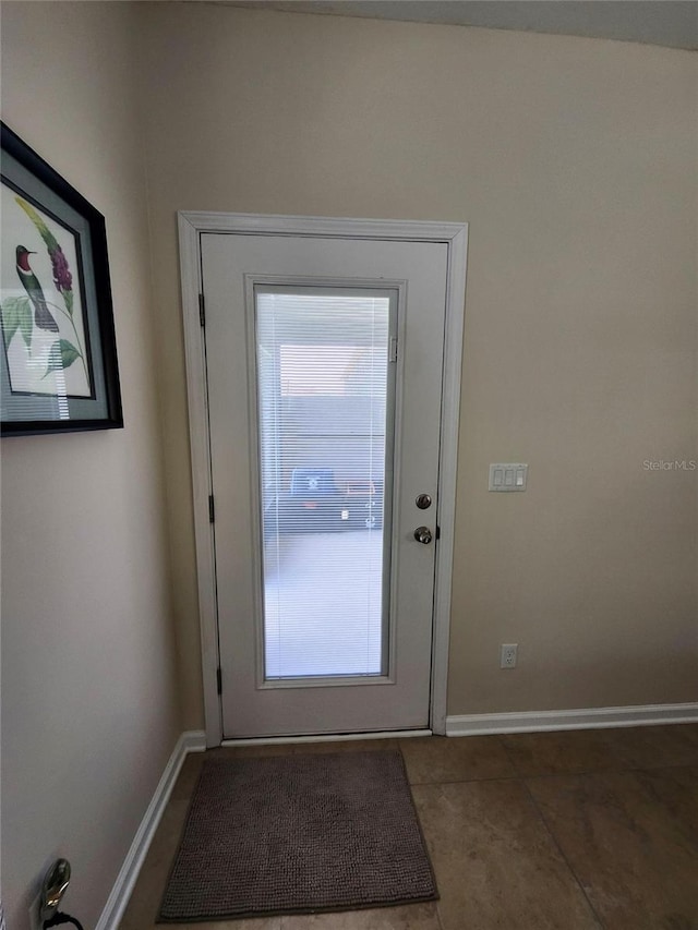 3281 Chestnut Ridge Way, Orange Park, FL 32065 - doorway featuring baseboards and tile patterned floors