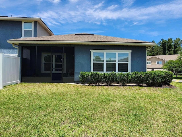 3281 Chestnut Ridge Way, Orange Park, FL 32065 - rear view of property featuring a sunroom, stucco siding, and roof with shingles