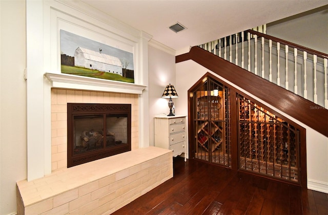 1653 Cheyenne Trl, Maitland, FL 32751 - wine area with hardwood / wood-style floors, ornamental molding, and a glass covered fireplace