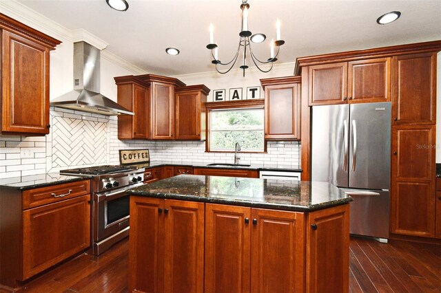 1653 Cheyenne Trl, Maitland, FL 32751 - kitchen featuring stainless steel appliances, wall chimney range hood, crown molding, a kitchen island, and dark wood-style floors