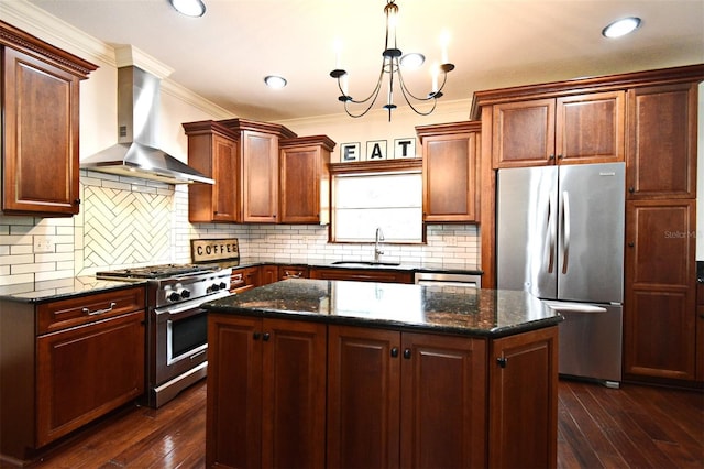 1653 Cheyenne Trl, Maitland, FL 32751 - kitchen with stainless steel appliances, wall chimney exhaust hood, a kitchen island, dark wood finished floors, and crown molding
