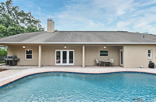 1653 Cheyenne Trl, Maitland, FL 32751 - swimming pool featuring french doors, grilling area, and a patio