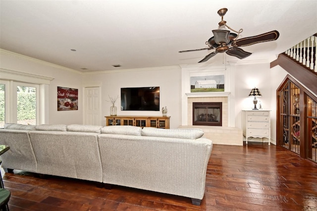 1653 Cheyenne Trl, Maitland, FL 32751 - living area featuring ceiling fan, dark wood-style floors, ornamental molding, and a glass covered fireplace