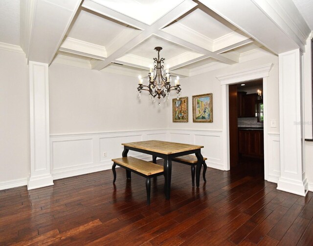 1653 Cheyenne Trl, Maitland, FL 32751 - dining area featuring a chandelier, beamed ceiling, dark wood-style floors, coffered ceiling, and a wainscoted wall