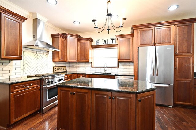 1653 Cheyenne Trl, Maitland, FL 32751 - kitchen with stainless steel appliances, wall chimney range hood, a kitchen island, dark wood-style flooring, and crown molding