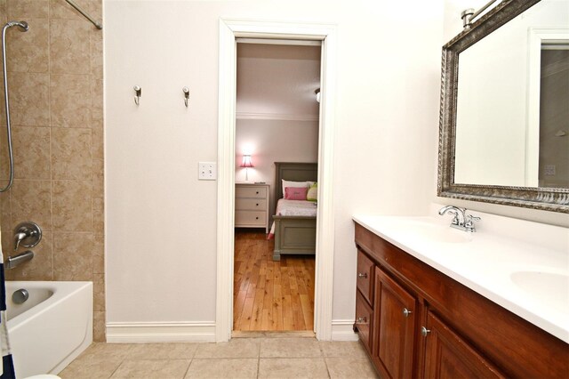 1653 Cheyenne Trl, Maitland, FL 32751 - bathroom with ensuite bath, double vanity, tile patterned floors, washtub / shower combination, and ornamental molding