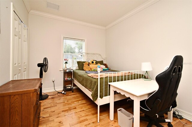 1653 Cheyenne Trl, Maitland, FL 32751 - bedroom with ornamental molding and light wood-style floors