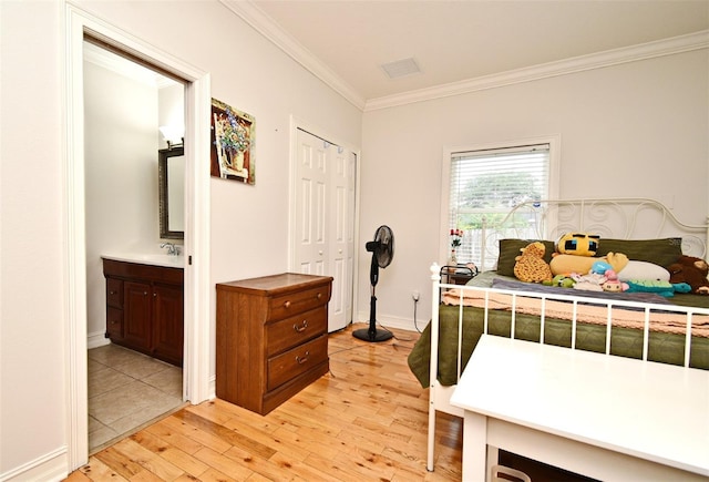 1653 Cheyenne Trl, Maitland, FL 32751 - bedroom with ornamental molding, light wood-style flooring, and ensuite bathroom