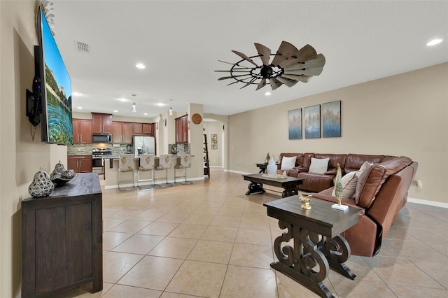 2319 Dammar St, Orlando, FL 32824 - living room featuring light tile patterned floors, recessed lighting, and ceiling fan