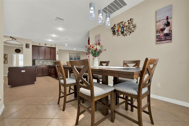 2319 Dammar St, Orlando, FL 32824 - dining space with light tile patterned floors and recessed lighting