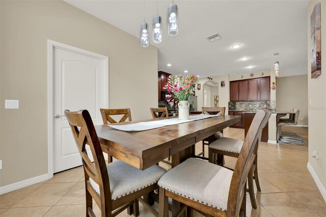 2319 Dammar St, Orlando, FL 32824 - dining room with light tile patterned floors and recessed lighting