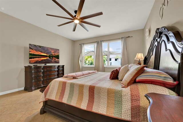 2319 Dammar St, Orlando, FL 32824 - bedroom with light tile patterned floors and ceiling fan