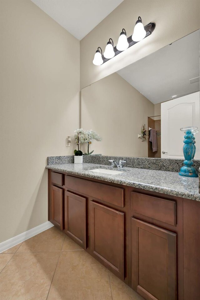 2319 Dammar St, Orlando, FL 32824 - bathroom featuring tile patterned floors and vanity