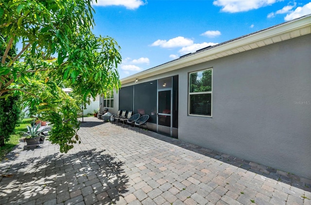 2319 Dammar St, Orlando, FL 32824 - view of patio / terrace featuring a sunroom