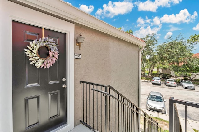 900 Northern Dancer Way Unit 204, Casselberry, FL 32707 - doorway to property featuring stucco siding