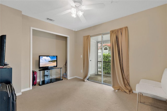 900 Northern Dancer Way Unit 204, Casselberry, FL 32707 - carpeted living area with ceiling fan and baseboards