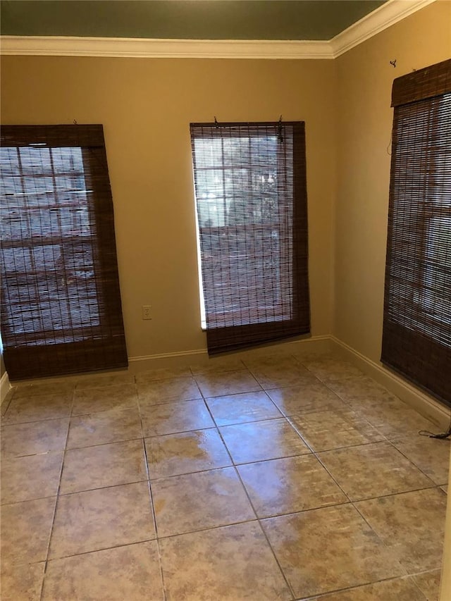 1910 NW 13th Pl, Ocala, FL 34475 - empty room featuring crown molding and tile patterned floors