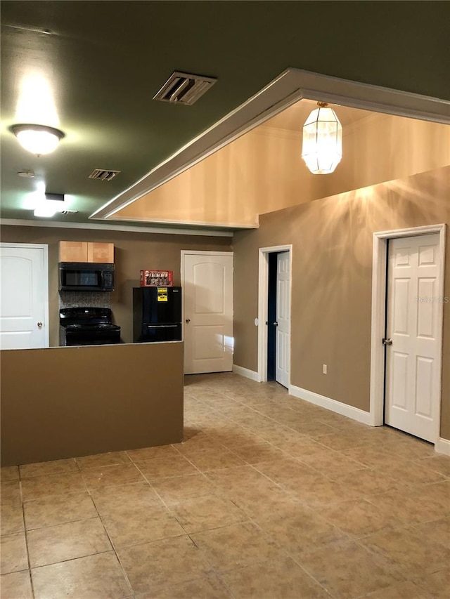 1910 NW 13th Pl, Ocala, FL 34475 - kitchen featuring black appliances and light tile patterned flooring