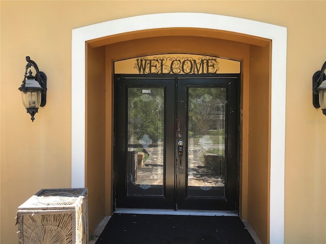 1910 NW 13th Pl, Ocala, FL 34475 - entrance to property with stucco siding and french doors