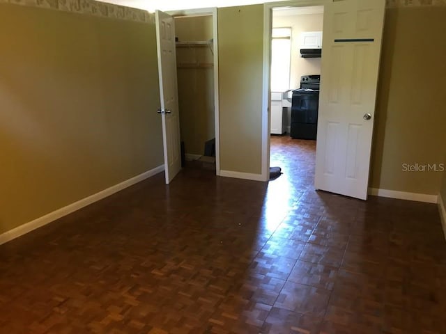 1910 NW 13th Pl, Ocala, FL 34475 - unfurnished bedroom featuring baseboards and a closet