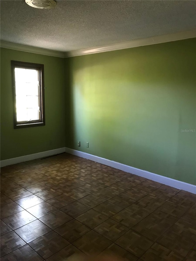 1910 NW 13th Pl, Ocala, FL 34475 - unfurnished room featuring crown molding and a textured ceiling