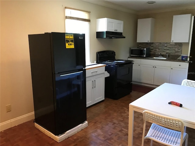 1910 NW 13th Pl, Ocala, FL 34475 - kitchen featuring black appliances, under cabinet range hood, white cabinets, ornamental molding, and tasteful backsplash