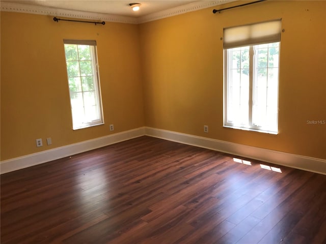1910 NW 13th Pl, Ocala, FL 34475 - spare room with dark wood-type flooring and baseboards