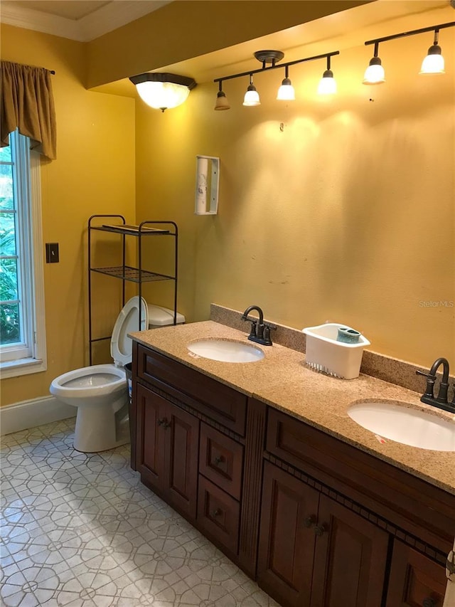 1910 NW 13th Pl, Ocala, FL 34475 - bathroom with double vanity and ornamental molding