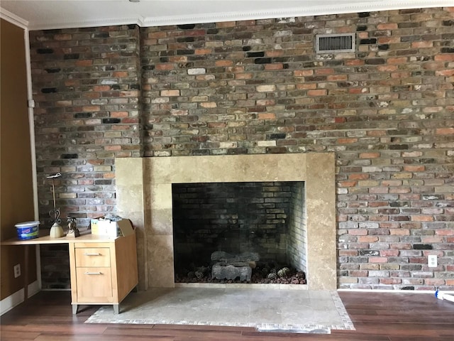1910 NW 13th Pl, Ocala, FL 34475 - detailed view of wood finished floors, a large fireplace, and crown molding
