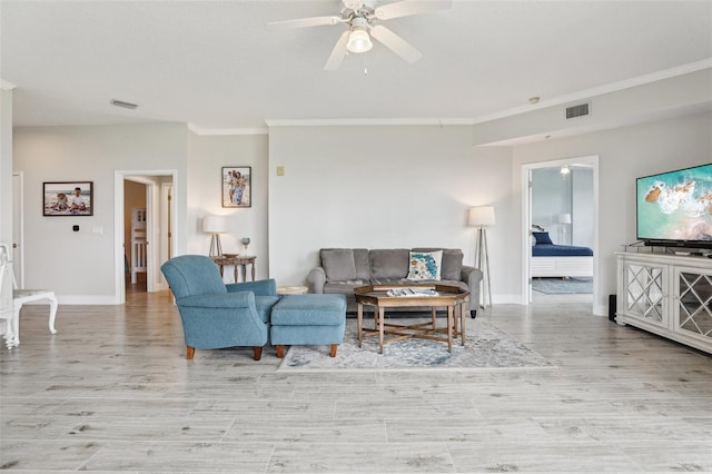 4650 Links Village Dr Unit B103, Ponce Inlet, FL 32127 - living area with crown molding, ceiling fan, and wood finished floors