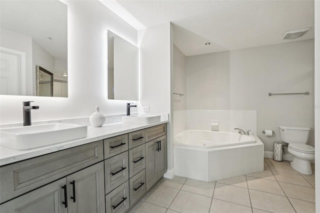 4650 Links Village Dr Unit B103, Ponce Inlet, FL 32127 - bathroom with double vanity, tile patterned flooring, and a tub with jets