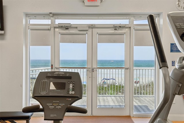 4650 Links Village Dr Unit B103, Ponce Inlet, FL 32127 - doorway to outside featuring view of water and beach and plenty of natural light