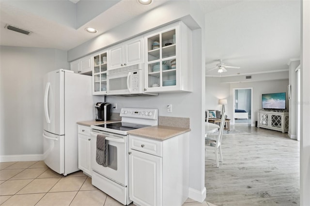 4650 Links Village Dr Unit B103, Ponce Inlet, FL 32127 - kitchen featuring white appliances, light countertops, a ceiling fan, white cabinetry, and recessed lighting