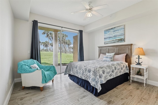 4650 Links Village Dr Unit B103, Ponce Inlet, FL 32127 - bedroom featuring access to exterior, wood finished floors, and a ceiling fan