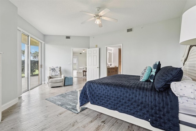 4650 Links Village Dr Unit B103, Ponce Inlet, FL 32127 - bedroom featuring access to outside, wood finished floors, a ceiling fan, and ensuite bathroom