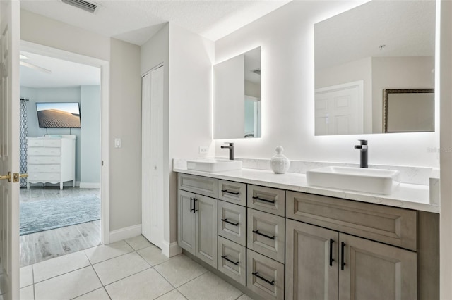 4650 Links Village Dr Unit B103, Ponce Inlet, FL 32127 - bathroom with double vanity and tile patterned flooring