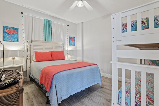 4650 Links Village Dr Unit B103, Ponce Inlet, FL 32127 - bedroom with wood finished floors and ceiling fan