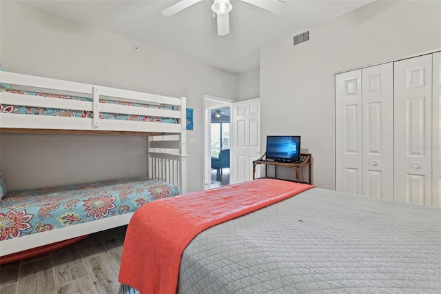 4650 Links Village Dr Unit B103, Ponce Inlet, FL 32127 - bedroom with wood finished floors, a closet, and a ceiling fan