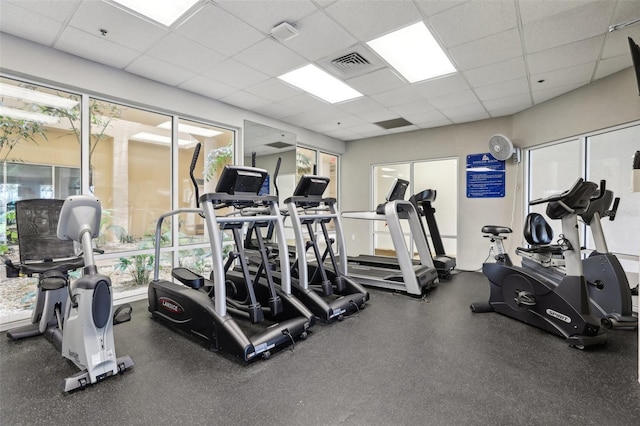 4650 Links Village Dr Unit B103, Ponce Inlet, FL 32127 - workout area with a paneled ceiling and healthy amount of natural light