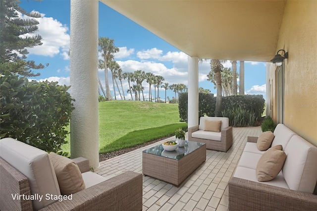 4650 Links Village Dr Unit B103, Ponce Inlet, FL 32127 - view of patio / terrace featuring an outdoor hangout area