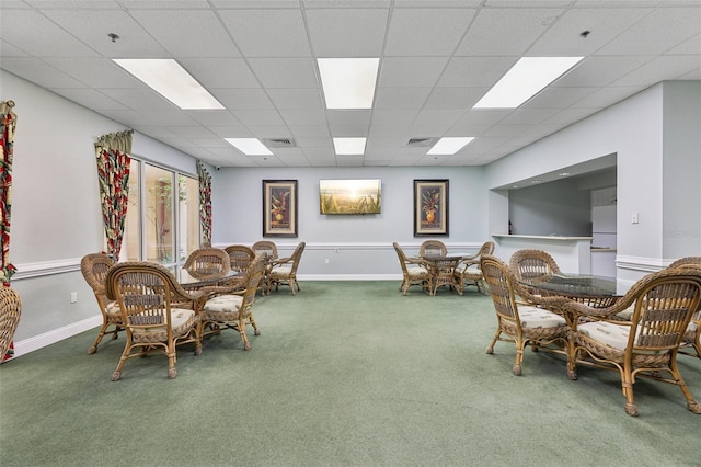 4650 Links Village Dr Unit B103, Ponce Inlet, FL 32127 - carpeted dining area with baseboards and a drop ceiling