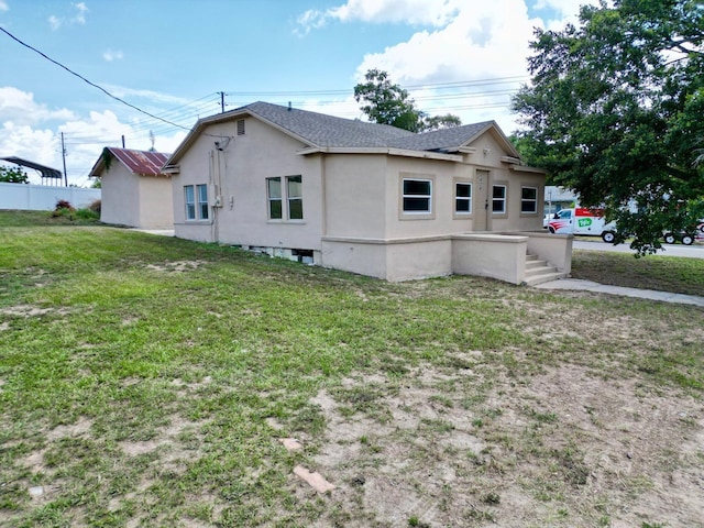 1020 E Main St, Haines City, FL 33844 - view of home's exterior with stucco siding and a shingled roof