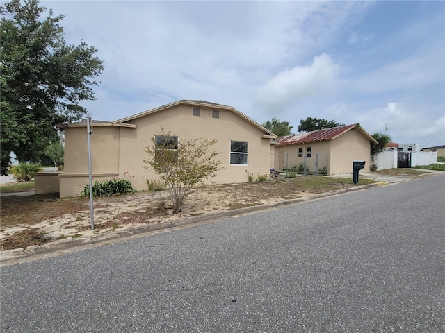 1020 E Main St, Haines City, FL 33844 - view of front facade with stucco siding